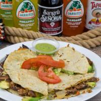 Chavindeca · Corn tortillas stuffed with cheese, meat, onion, cilantro and salsa. Avocado sauce on the si...