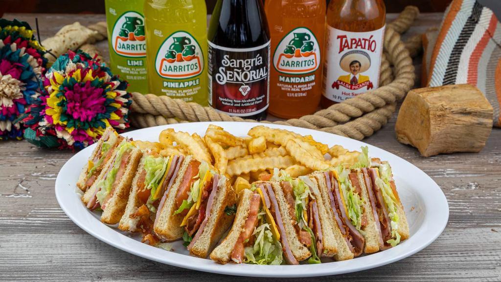 Club Sandwich · White bread with ham, bacon, mayonnaise, lettuce, tomato and cheese. Served with french fries.