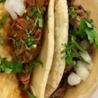 Sampler Tacos · Three small tacos on soft (corn or flour) tortillas served with onions and cilantro. Choose ...