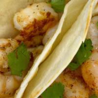 Garlic Shrimp Quesadillas · Shrimp sauteed in butter and garlic. Three small tacos with melted Chihuahua style cheese on...