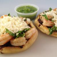 Garlic Shrimp Sopes · Two flat thick corn tortillas topped with black beans, onions, cilantro and Fresco cheese.