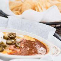 Diablo Dip · Our homemade Queso topped with chili, sour cream, tomato, onion, & jalapeno.
Served with chi...