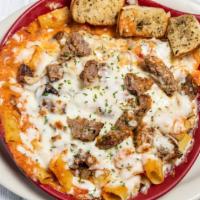 Sausage Rigatoni · Italian sausage sauteed with onions and mushrooms and rosa sauce, then baked with mozzarella...