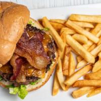 Cheddar Bacon Burger · Our Half Pound burger served with mayo, lettuce, tomato, 3 strips of bacon and cheddar.