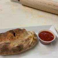 Calzone · Any three toppings baked in a golden pizza pocket with marinara and mozzarella cheese.