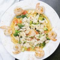 Seafood Pasta · Shrimp, crab, zucchini, broccoli and cherry tomatoes sautéed in garlic olive oil sauce and s...
