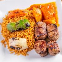 Seekh Kabob · Char-broiled marinated lamb tenderloin. Served with grilled vegetables and pallow rice.