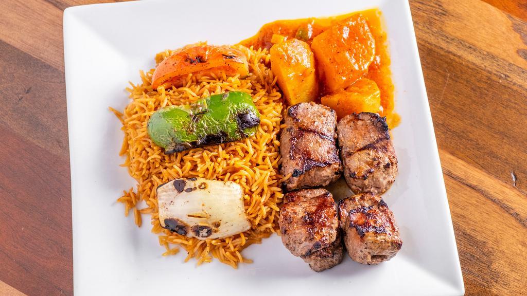 Seekh Kabob · Char-broiled marinated lamb tenderloin. Served with grilled vegetables and pallow rice.