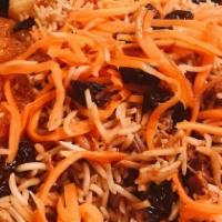 Kabuli Pallow · Cinnamon scented basmati rice with chunks of lamb tenderloin, raisins, and glazed julienne o...