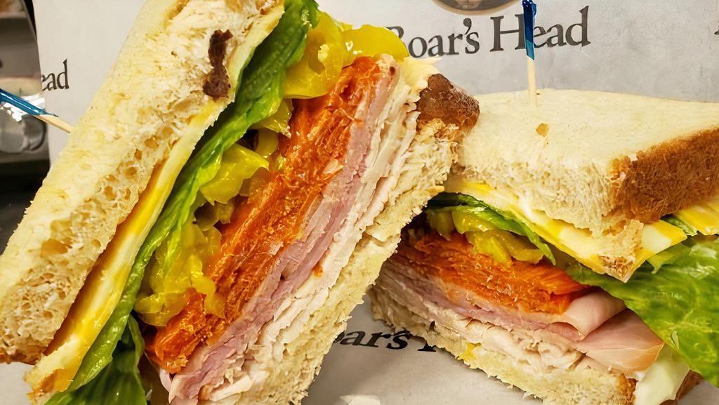 Mountain Man · Oven-roasted turkey, black forest ham, pepperoni, 3-pepper Colby jack cheese, banana peppers, lettuce, mayo and deli dressing on white bread