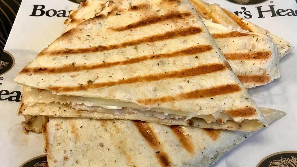 Quesadilla · Custom-build a quesadilla with your choice of meat, cheese, condiment, and a topping.