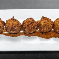 Artichoke Fritters · Vegetarian. Artichoke hearts battered and fried until golden brown. Served with Cajun remoul...