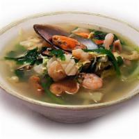 Udon (우동) · Noodles with squid, mussel, and vegetables in seafood broth soup.