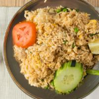 Thai Fried Rice · Vegan. A classic thai stir-fried jasmine rice with onions, tomatoes, scallions, peas and car...