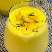 Mango Lassi · Mango drink with mango pulp, yogurt, saffron.