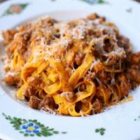 Tagliatelle Bolognese · pasta ribbons, ragu' bolognese, parmesan