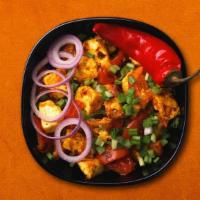 Cottage Cheese Chilli Kung Fu · A dish of Indo-Chinese origin, soft cottage cheese cooked with garlic, bell peppers and onio...
