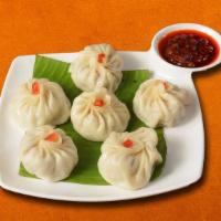 Steamed Dumpling Surprise Chicken · Enjoy these delicious steamed dumlings served in your choice of either vegetable, chicken. W...