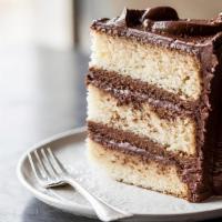 Old-Fashioned Diner Cake, Slice · Just like Grandma used to make (only better!). Golden cake layers with chocolate buttercream...