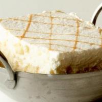 Tres Leches, Slice · Yellow sponge cake soaked in evaporated milk, condensed milk and cream and drizzled with car...