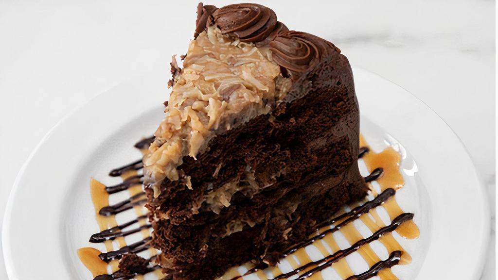 German Chocolate Cake, Slice · Moist chocolate cake with our homemade caramel-coconut-pecan filling. Iced with chocolate buttercream.