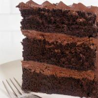 Vegan Mom'S Chocolate Cake, Slice (V) · The Vegan version of one of our most popular cakes! You can always count on Mom. Moist choco...