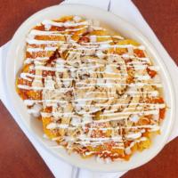 Chilaquiles  · Red or green sauce served over tortilla chips and topped with queso fresco, onion, and sour ...