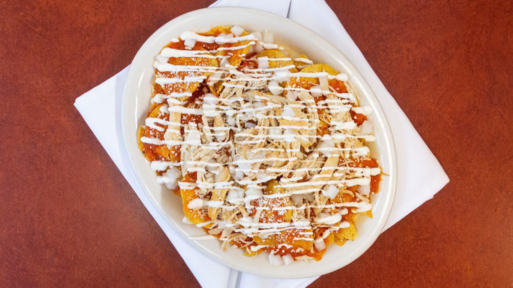 Chilaquiles  · Red or green sauce served over tortilla chips and topped with queso fresco, onion, and sour cream.