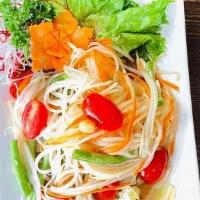 Som Tum · Green Papaya, Tomatoes, String Beans, Carrot And Peanuts Tossed With Spicy Lime Dressing.