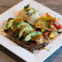 Ribeye Ranchero · avocado, gulf shrimp, chipotle-lime habanero cream, garlic mashed potatoes, sautéed vegetables