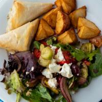 Spanakopita · Baked filo triangles filled with sauteed spinach and onion topped with feta. served with ric...