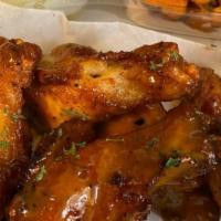 Eatery Wings Platter · Seven twice cooked flavored wings with two sides.
