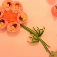 26 Sakura Roll (Cooked) · Shrimp tempura, avocado, mango, crab wrap up with soy paper.