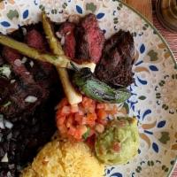 Carne Asada · Grilled skirt steak served with grilled pepper, green onions, grilled jalapeño, Broccoli, an...