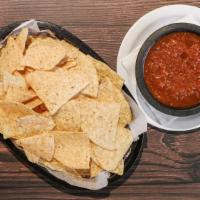 Chips And Salsa · A generous portion of tortilla chips and our homemade tomato salsa.
