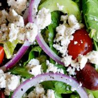 Greek · Our Garden salad topped with Kalamata olives and feta cheese, served with Greek dressing