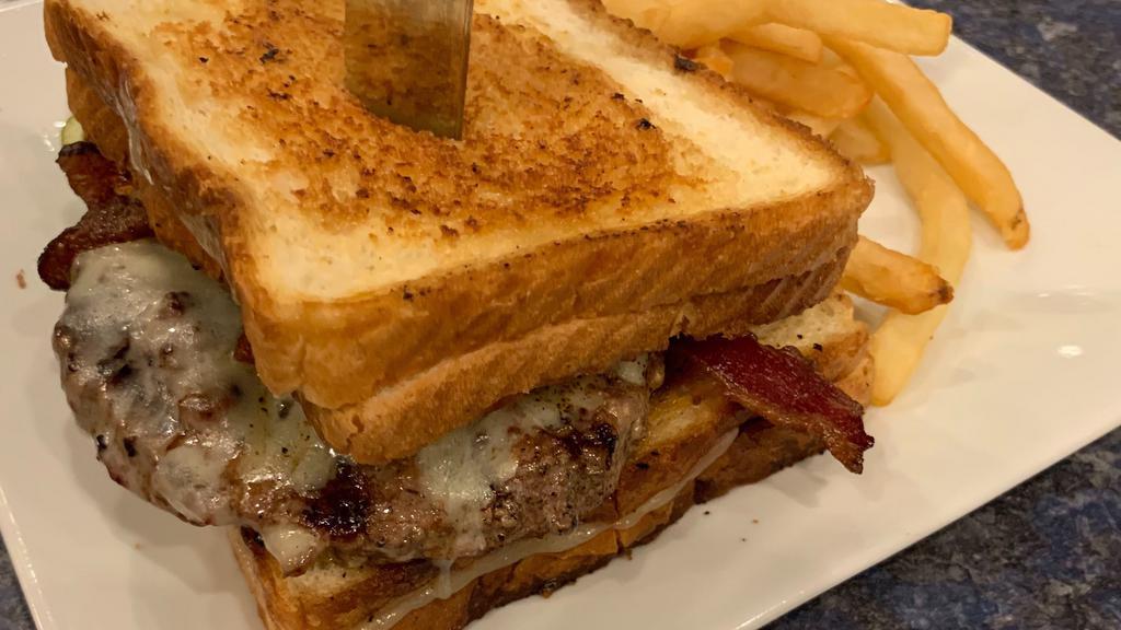 The Extreme Cheeseburger · Bet you can't finish it!  Fresh 8 oz certified Angus beef burger, bacon, cheese, between two grilled cheese sandwiches