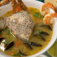 Sopa De Mariscos · A delightful combination of shrimp, mussels, crab, and tilapia served with handmade tortillas.
