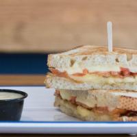 Grilled Cheese · Country White Sliced Bread, Aged Cheddar, Havarti, Cured Bacon, Sliced Tomato, Mornay Sauce