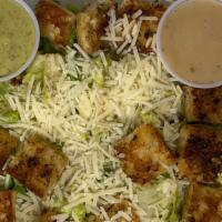 Caesar Salad · Romaine lettuce, croutons fried in olive oil, Parmesan cheese, Caesar dressing.