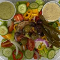 Green Salad · Romaine lettuce, tomato, cucumber, bell pepper, onion, olive oil, salad dressing, topped wit...