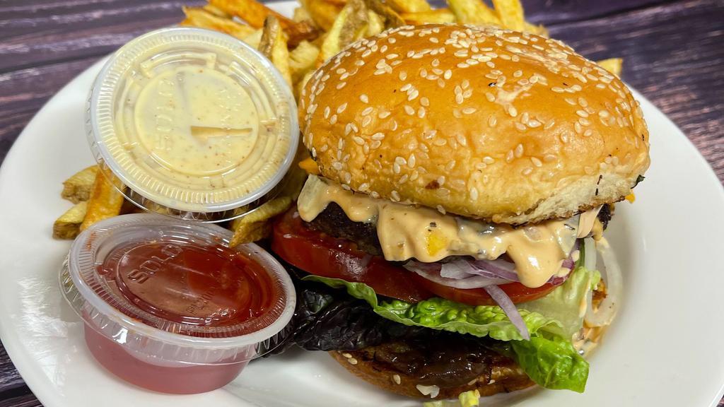 Burger Sandwich · Burger bun, beef burger, lettuce, tomato, onion, special sauce, served with fresh fries and special pickles.