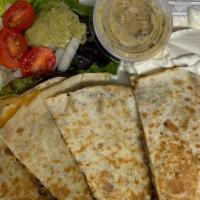 Beef Quesadilla · Flour tortilla, ground beef and onion sauté, two cheeses, served with pico de gallo and sour...