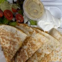 Chicken Quesadilla · Flour tortilla grilled chicken pieces, two cheeses, served with pico de gallo and sour cream.