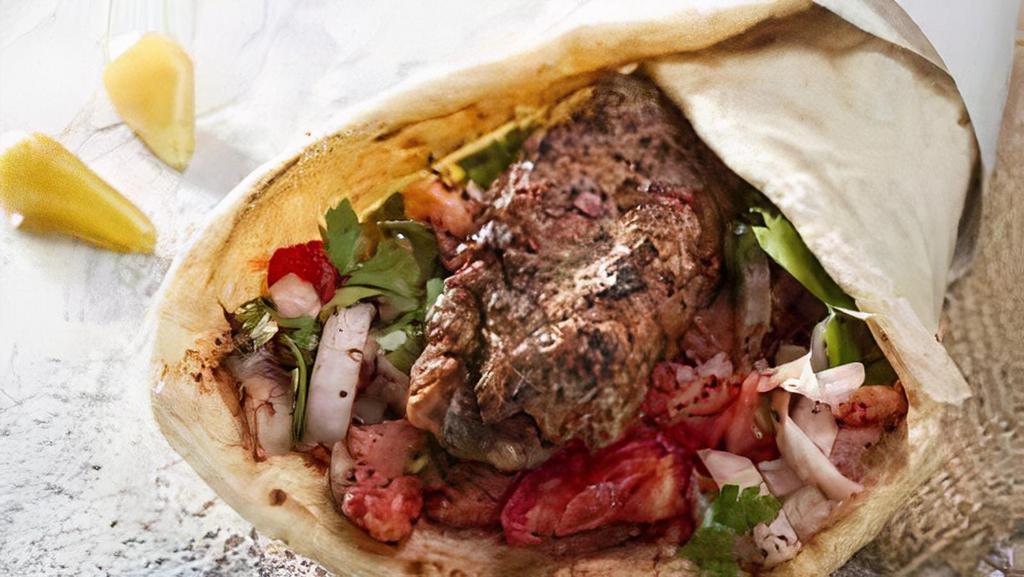 Kabab Sandwich · Beef, or Lamb, Flatbread, Onion, Pickles, Tomato, Tahini or Garlic