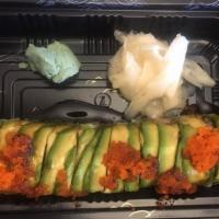 Dragon Roll · Eel and cucumber topped with avocado, eel sauce and flying fish egg.