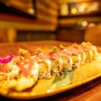 Ninja Roll · inside out roll filled with shrimp tempura, cilantro, cucumber, & avocado, topped with yello...