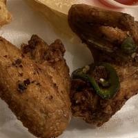 Jalapeño Chicken Wings · Spicy. Four whole wings.