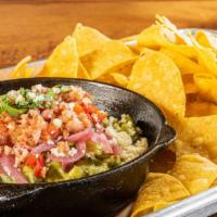 Loaded Guacamole · Bacon, jalapeño, pickled red onion, queso fresco.