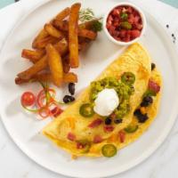 Mexican Omelette  · Three eggs, cheese, onion, green pepper, tomato, and chili cooked as an omelette served with...